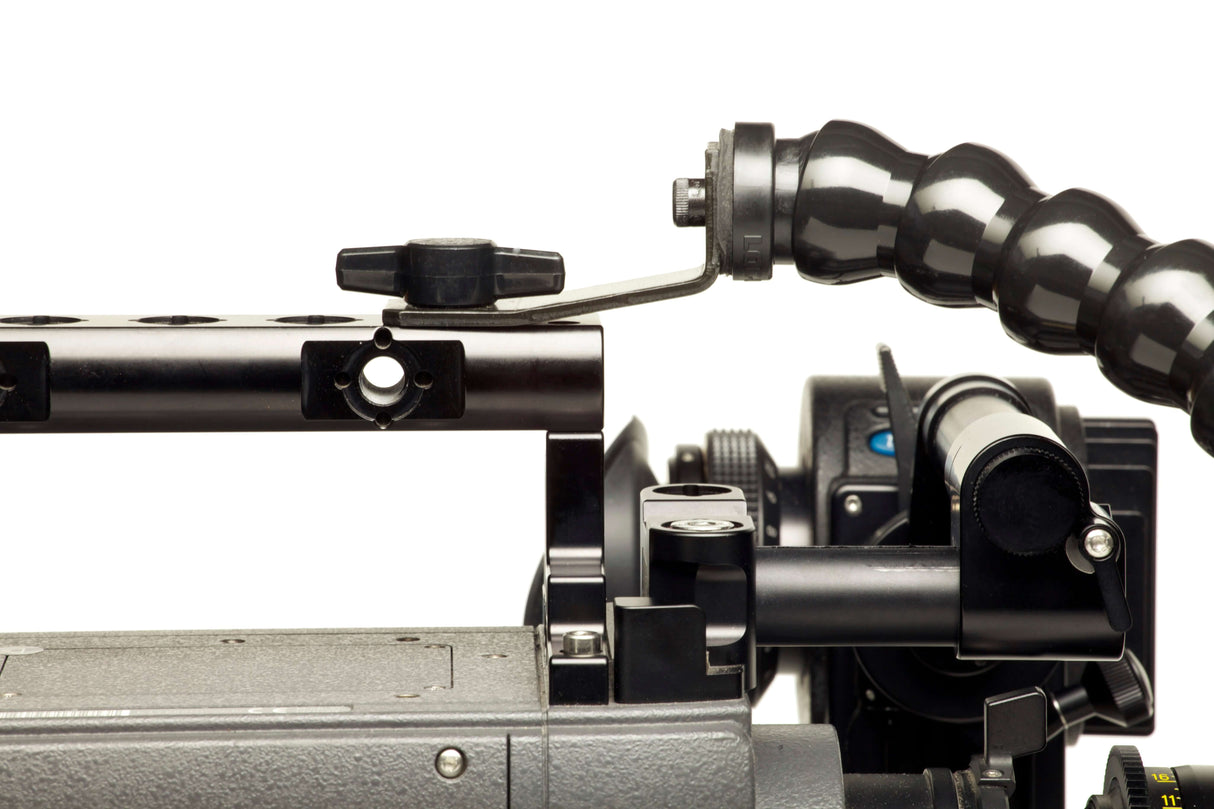 Close-up of a fixed base mount attached to a camera, showcasing adjustable components for accessories.