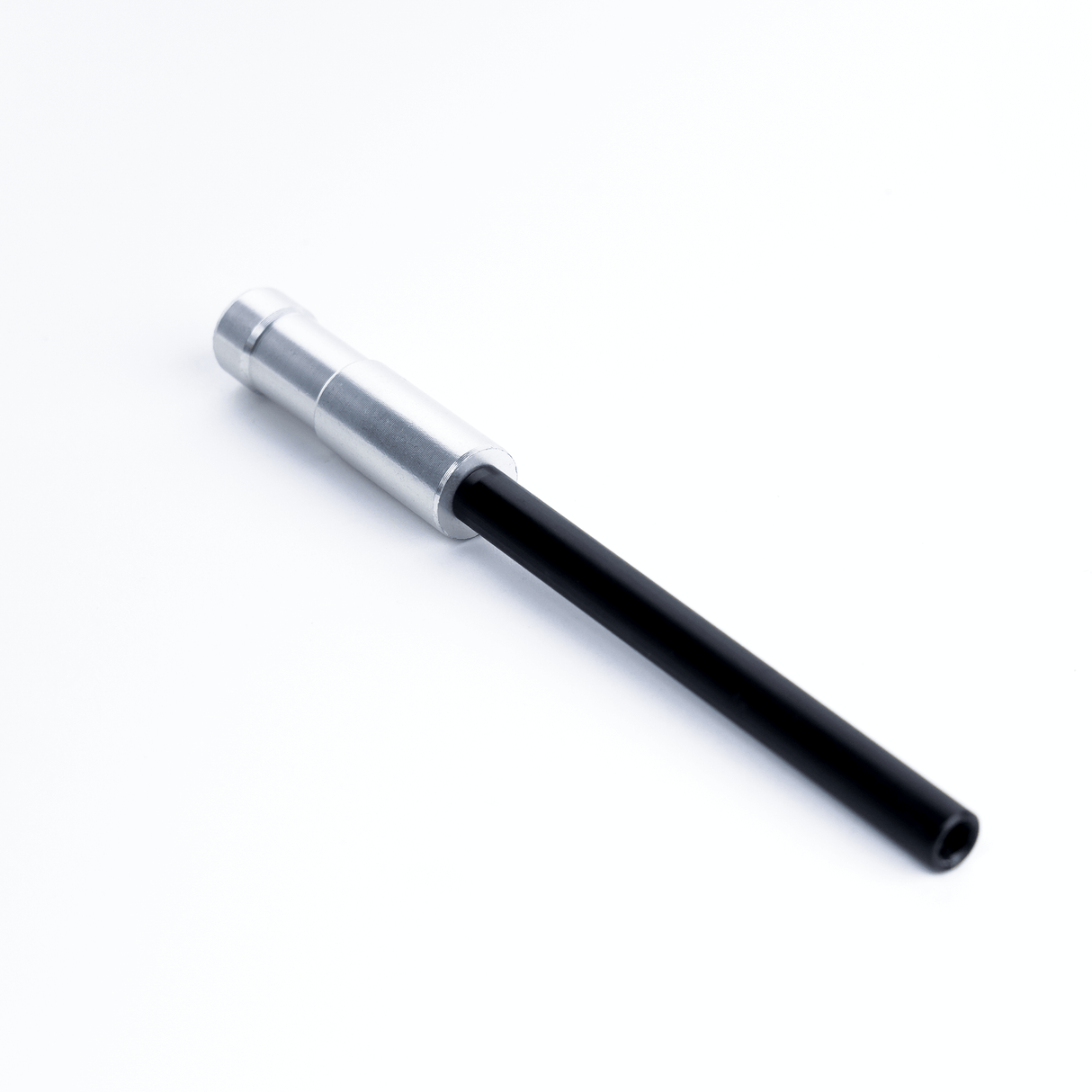 Close-up of a MICROGrip rigging accessory with a metal collar and black shaft, designed for versatile mounting solutions.