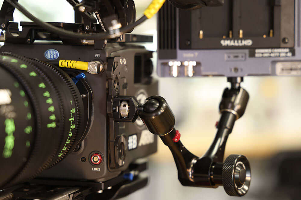 Close-up of a camera rig featuring the Anti-Rotation Tip with 3/8"-16 thread on the Infinity Arm for secure mounting.