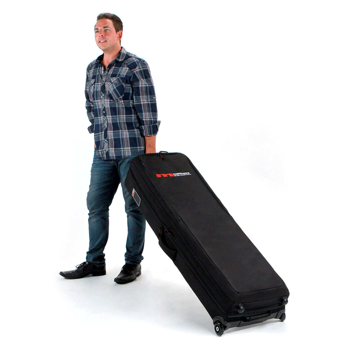 Person pulling a Matthews C-Stand Rolling KitBag on wheels for easy transportation of C-Stands on small or traveling productions.