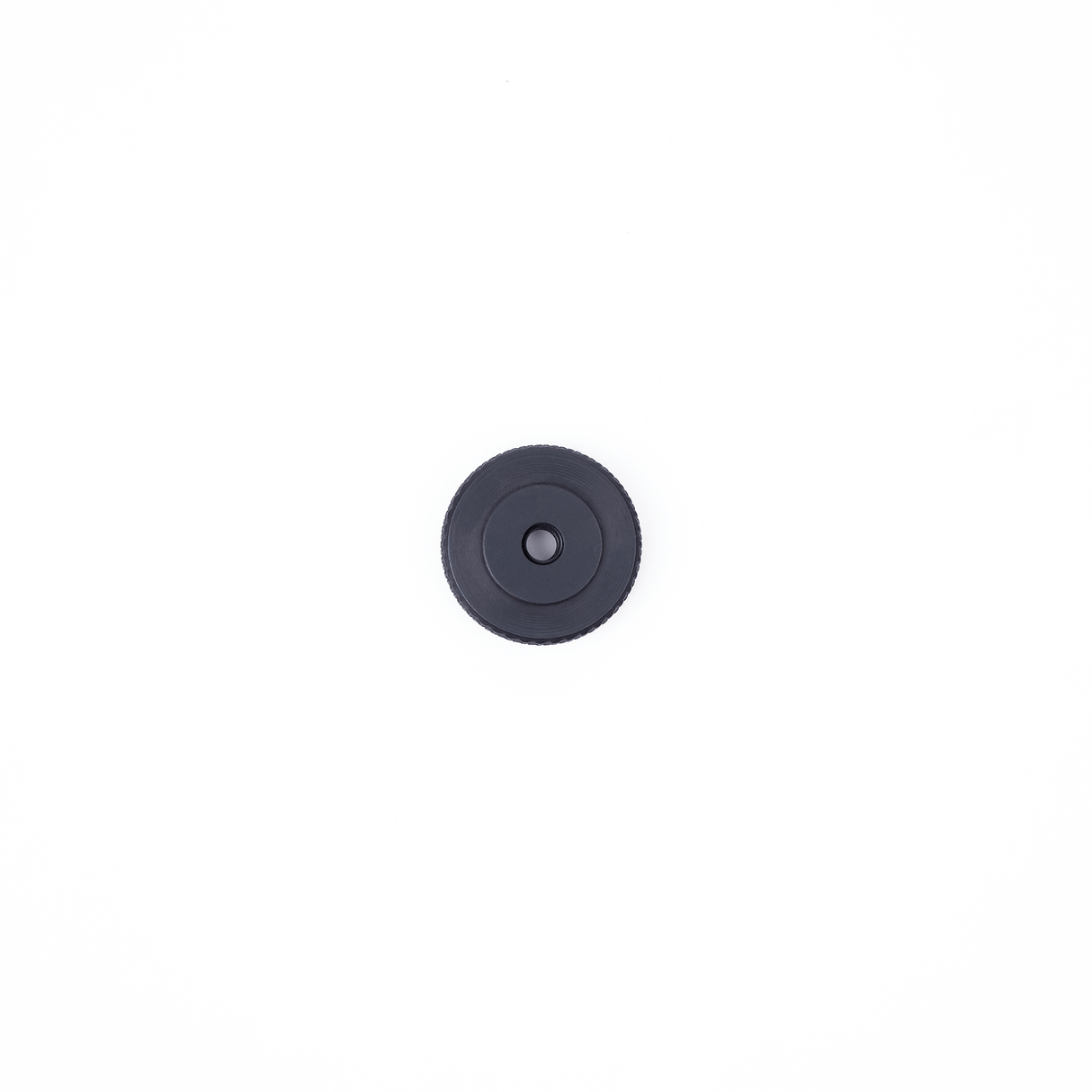 Black circular rigging accessory for the MICROGrip Master Rigging Kit on a white background.