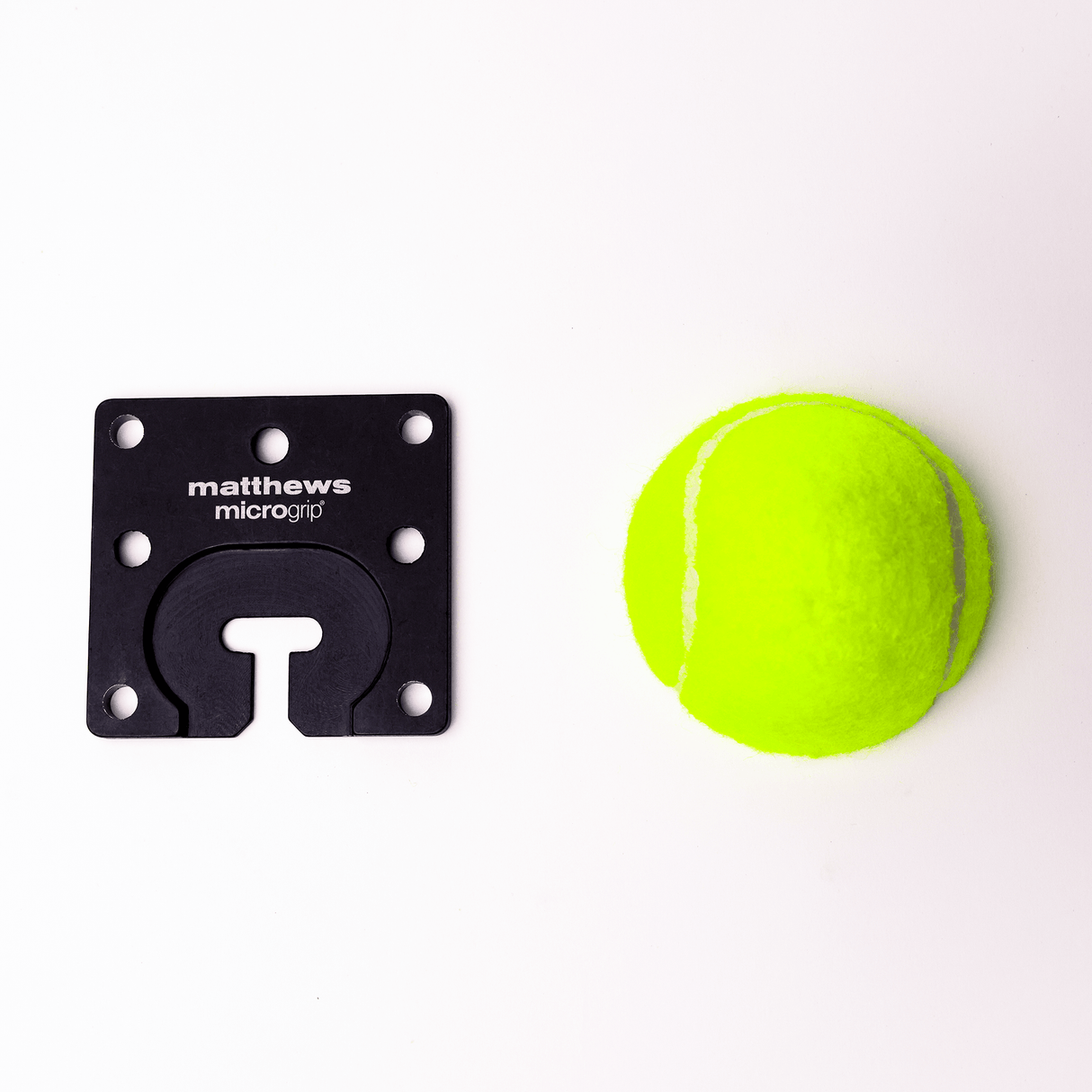MICROGrip Master Rigging Kit component alongside a bright yellow tennis ball, showcasing versatility in rigging solutions.