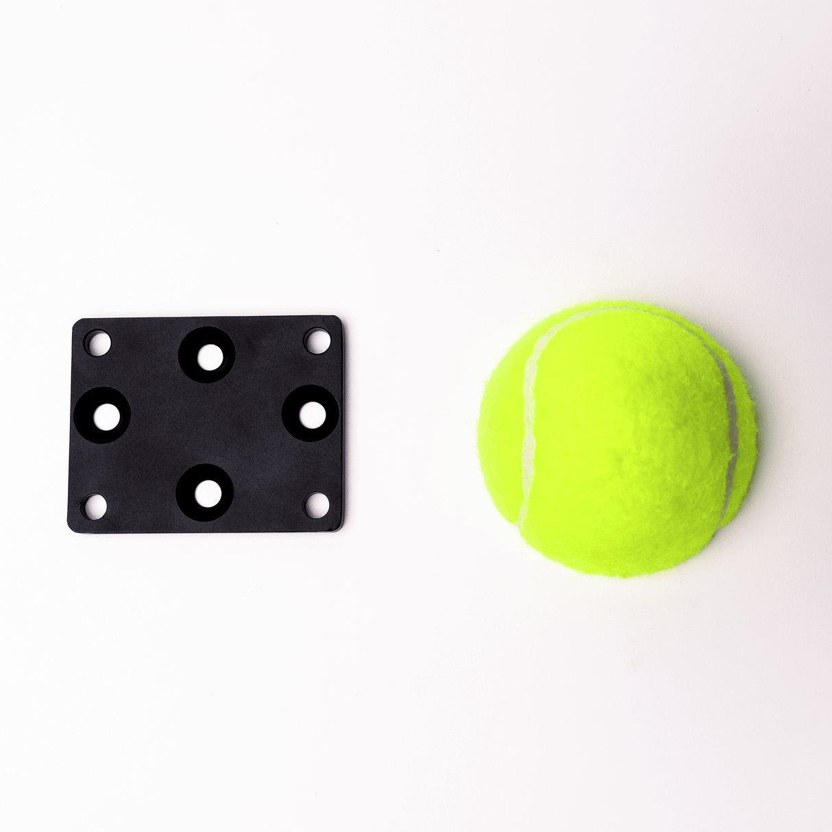 MICROGrip Master Rigging Kit components: black mounting plate and bright green tennis ball for versatile rigging solutions.