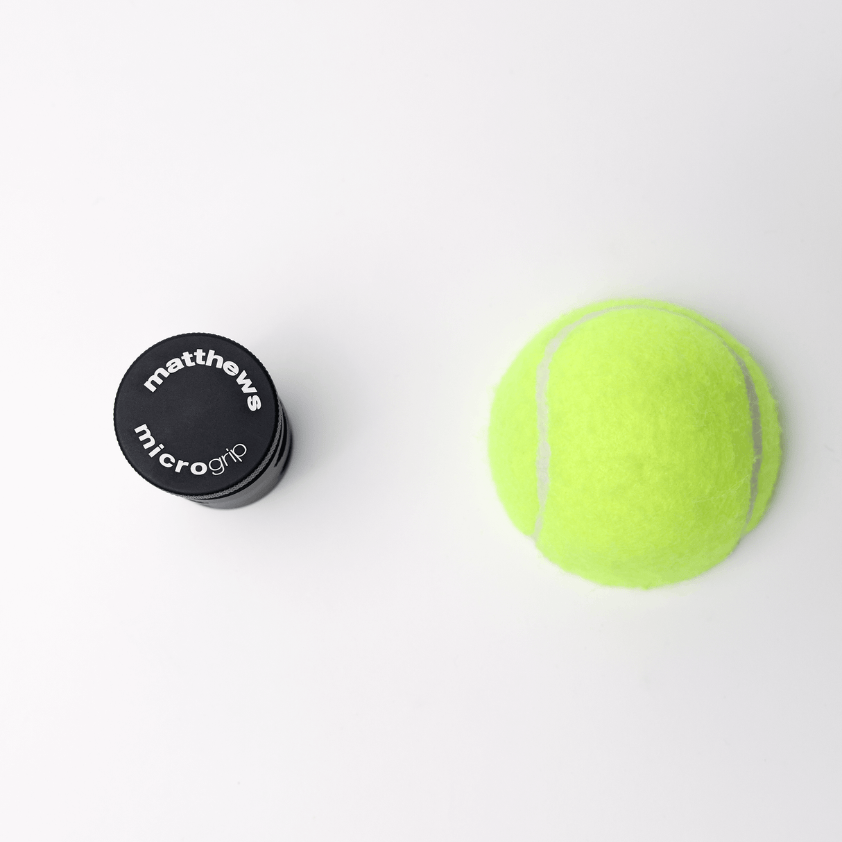 MICROGrip rigging component next to a bright green tennis ball on a white background.