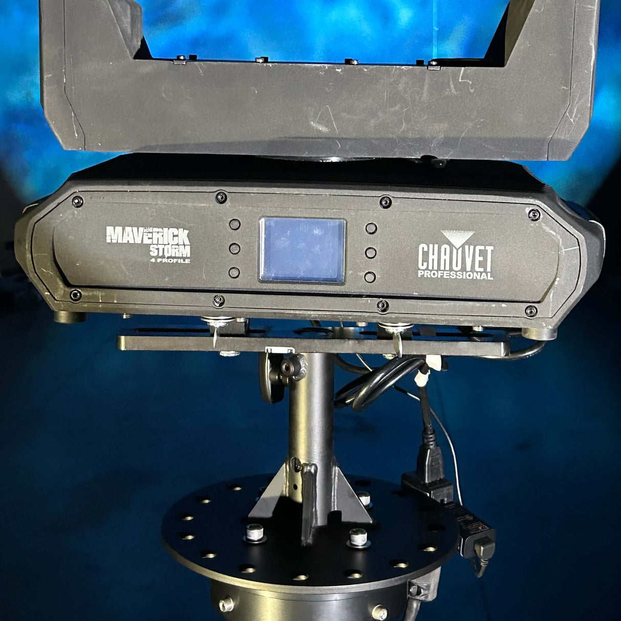 Chauvet Professional Maverick Storm moving light mounted on a sturdy stand in a production setting.