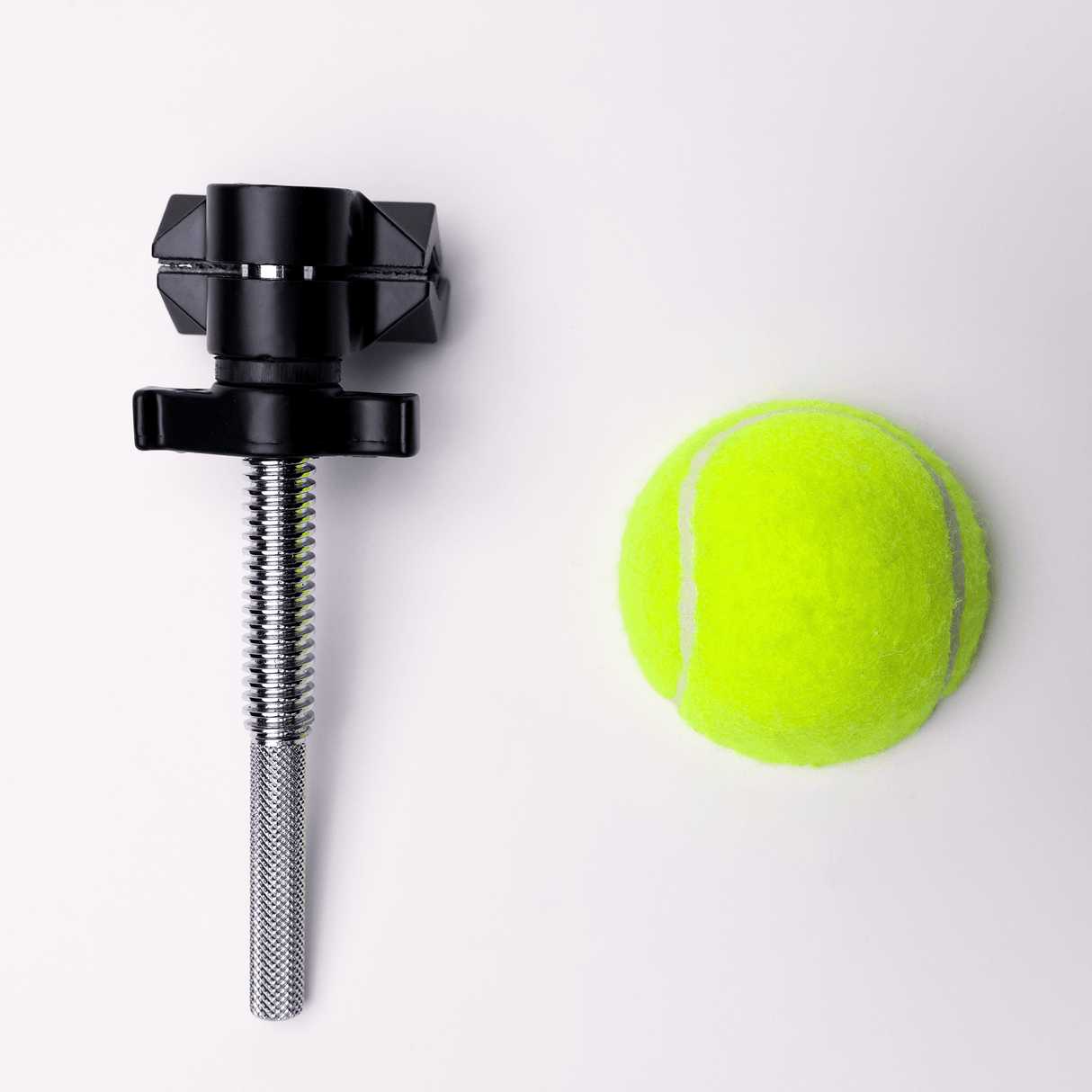 MICROGrip Master Rigging Kit component next to a bright green tennis ball on a light background.