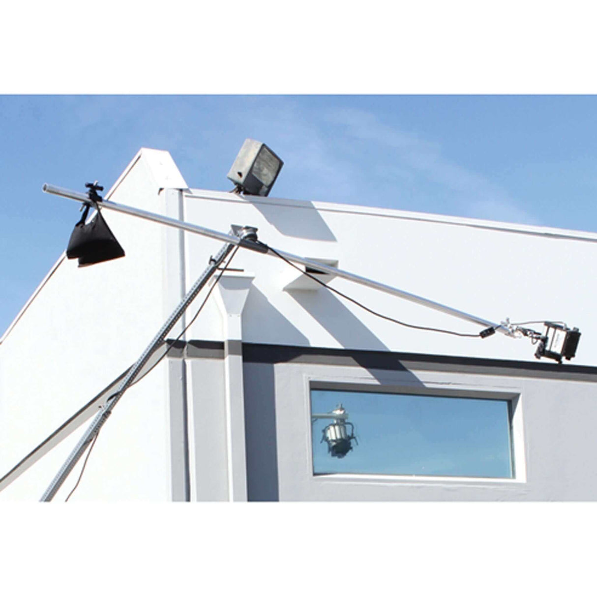 MAX 6' Extension Arm mounted on building, demonstrating light positioning for optimal angles and reach.