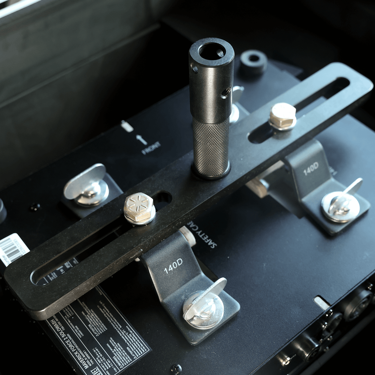 Moving Light Stand Adapter "Cotone Mount" showcasing dual-slotted plate and knurled jr pin for secure attachment.