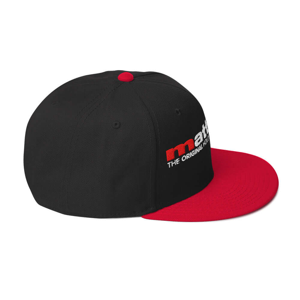 MSE Snapback Hat featuring a black body and red bill, showcasing modern design and sophistication.