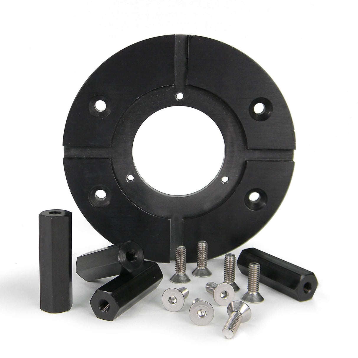 Dutti Dolly Mitchell Riser Kit components including a circular riser plate and various screws and spacers.