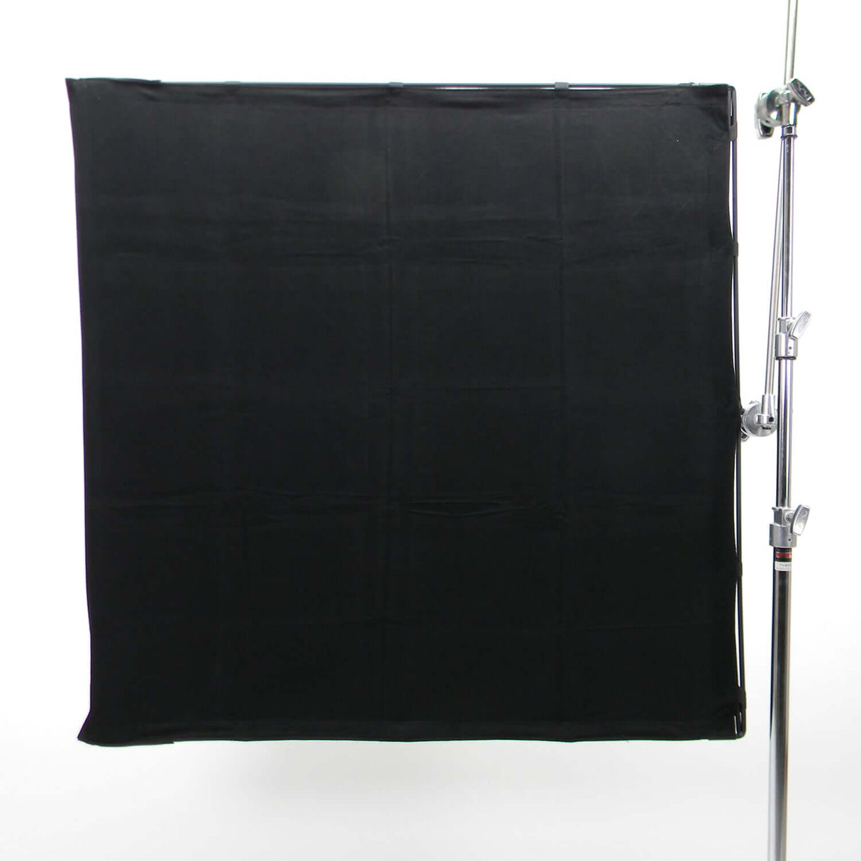 RoadFlags II Accessories black backdrop fabric on a stand for photography and film setup.