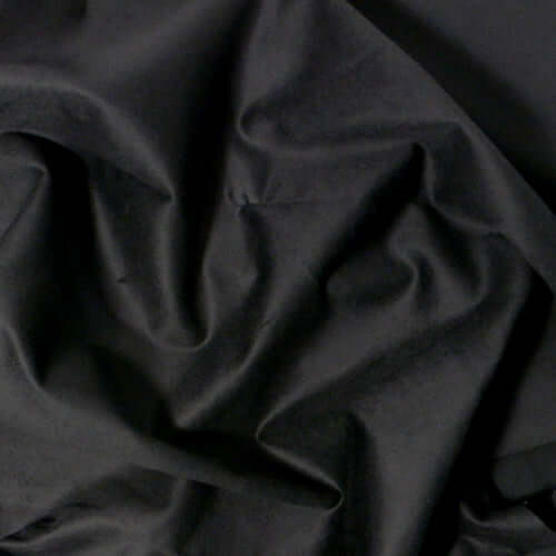 Close-up of 8'x8' solid black fabric, showcasing its soft texture and smooth finish for various applications.