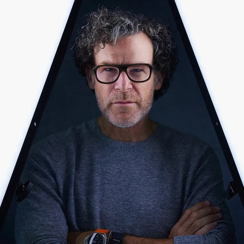 Star Headshot Photographer Peter Hurley Gung Ho for Matthews Stands posing in a studio with unique lighting.