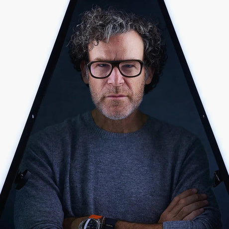 Star Headshot Photographer Peter Hurley Gung Ho for Matthews Stands posing in a studio with unique lighting.