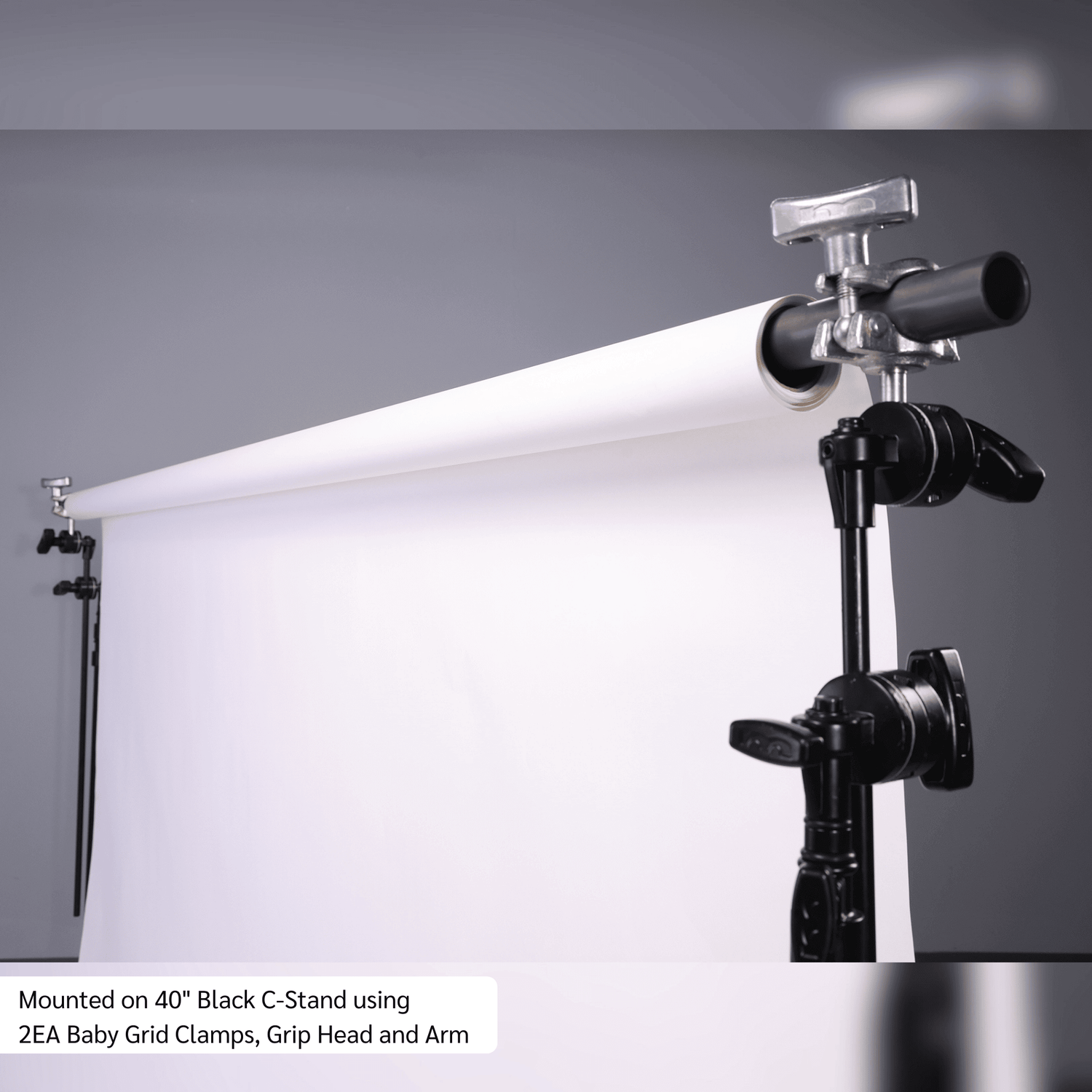 Grip Rail mounted on a 40" Black C-Stand with baby grid clamps for versatile imaging and rigging applications.