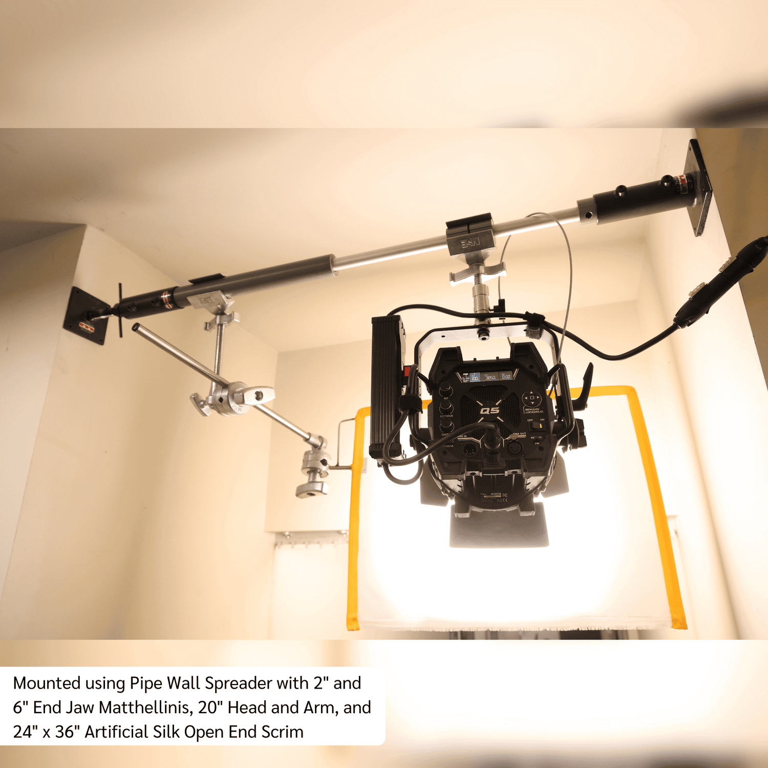 Telescoping Grip Rail setup with camera, lights, and scrim for versatile imaging applications.