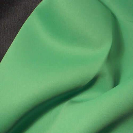 Close-up of a 6'x6' green screen chromakey fabric, ideal for video and photography backgrounds.