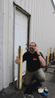 Grip Rail candlestick rig: rail strapped vertically to an existing post, then a lighting fixture mounted on the rail and adjusted