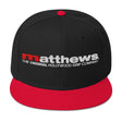 Matthews Snapback Hat featuring a sleek black design with a red bill and logo, ideal for stylish functionality.