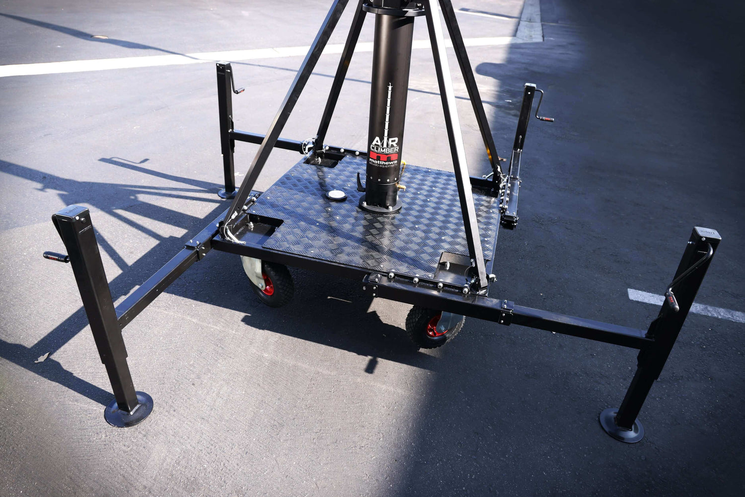 Air Climber rental stand showcasing pivot ring and mast design in outdoor location